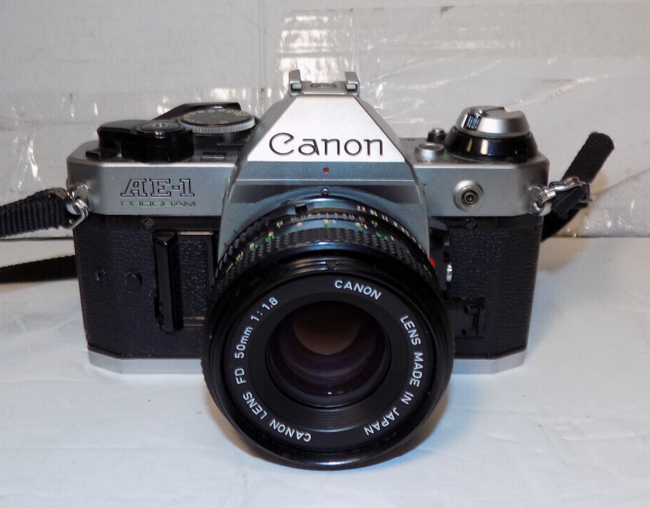 Canon AE-1 Program SLR 35mm Film Camera With 50mm 1:1.8 FD Lens With Case