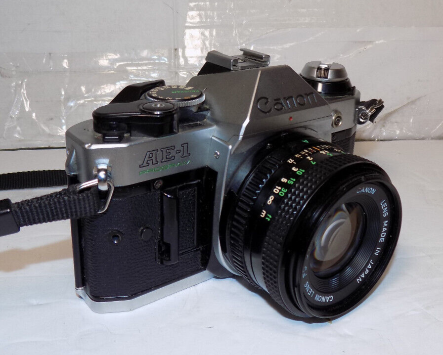 Canon AE-1 Program SLR 35mm Film Camera With 50mm 1:1.8 FD Lens With Case
