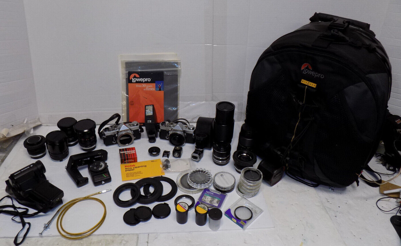 2 Olympus OM 1 35mm SLR Film Cameras with Lenses Filters Backpack and More