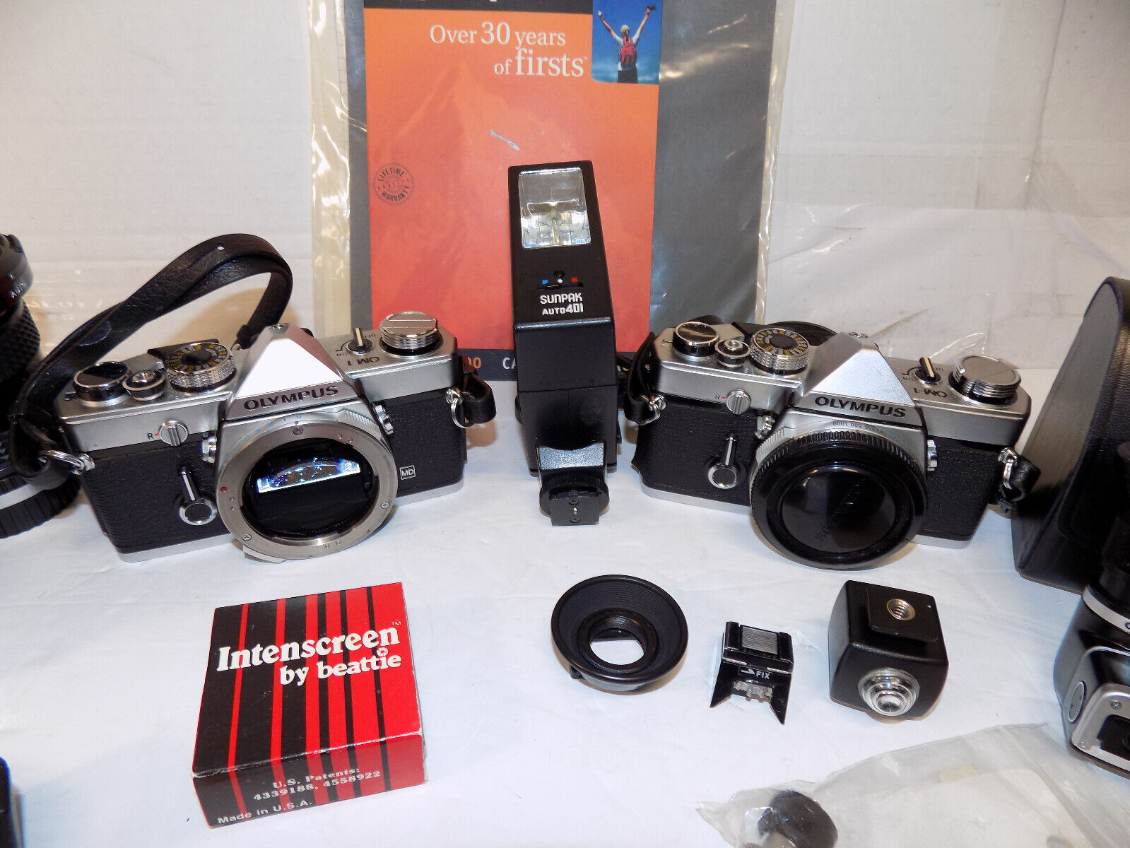 2 Olympus OM 1 35mm SLR Film Cameras with Lenses Filters Backpack and More