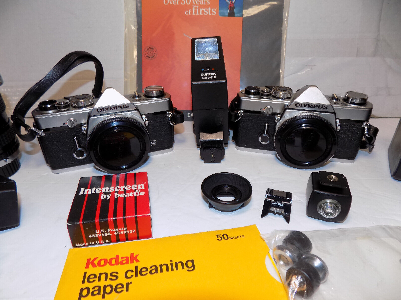 2 Olympus OM 1 35mm SLR Film Cameras with Lenses Filters Backpack and More